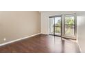 Bright bedroom with hardwood floors, balcony access and windows at 8635 Clay St # 417, Westminster, CO 80031