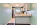 Modern kitchen has stainless steel appliances, breakfast bar seating, and sleek finishes, creating an inviting culinary space at 8635 Clay St # 417, Westminster, CO 80031
