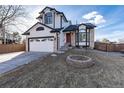 Charming two-story home with landscaped yard and inviting fire pit, perfect for outdoor entertaining at 1314 Ascot Ave, Highlands Ranch, CO 80126