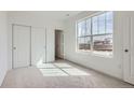 Bright bedroom with large window and closet with sliding doors at 2098 S Haleyville Way, Aurora, CO 80018