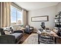 Inviting living area with comfortable seating, a large window, and a view at 6531 14Th St, Frederick, CO 80530