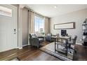 Inviting living area with a large window, comfortable seating, and a cozy workspace at 6531 14Th St, Frederick, CO 80530