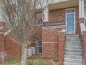 Charming brick townhouse featuring a welcoming entrance and a touch of classic American style at 9813 E Carolina Pl, Aurora, CO 80247