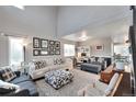 Bright living room featuring vaulted ceilings, large windows, and neutral tones throughout at 36545 Winchester Rd, Elizabeth, CO 80107
