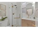 Updated bathroom with a glass shower, modern vanity, and neutral tile at 2931 N Josephine St, Denver, CO 80205