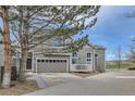 Attractive townhome with a gray exterior, an attached two-car garage, and a nicely kept driveway at 3228 47Th, Boulder, CO 80301
