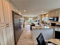 Spacious kitchen featuring stainless steel appliances, double ovens, and granite countertops at 1063 Clarke Ct, Castle Rock, CO 80109