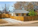 Cozy single-story home featuring a private fenced yard and a convenient driveway for off-street parking at 1171 Quebec St, Denver, CO 80220