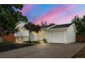 Beautifully maintained two-story house with a spacious driveway and attached garage at 2108 S Idalia St, Aurora, CO 80013