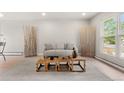 Bright living room featuring neutral tones, stylish decor, and large windows for natural light at 2108 S Idalia St, Aurora, CO 80013