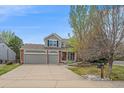 Inviting home with a manicured front yard, and a three-car garage, perfect for families at 18168 E Caley Cir, Aurora, CO 80016