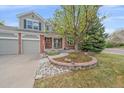 Beautifully landscaped front yard, and an inviting entrance, enhancing the home's curb appeal at 18168 E Caley Cir, Aurora, CO 80016