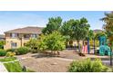 Community playground with colorful equipment including a slide and climbing structure, located in green neighborhood at 847 E 98Th Ave # 1806, Thornton, CO 80229