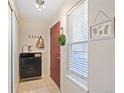 Bright entryway with stylish storage, coat hooks, and a window with natural light at 5300 E Cherry Creek South Dr # 124, Denver, CO 80246