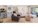 Cozy living room with an open floor plan featuring plush seating and a sliding glass door at 5300 E Cherry Creek South Dr # 124, Denver, CO 80246
