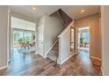 Welcoming entryway with wood floors, staircase, and views into the dining and living spaces at 638 W 175Th Ave, Broomfield, CO 80023