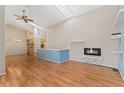 Bright, open living room with hardwood floors, fireplace and skylights at 4195 W 111Th Cir, Westminster, CO 80031