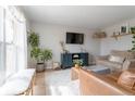 Inviting living room with a media center, comfortable seating, and a large window at 4653 S Yank St, Morrison, CO 80465