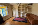 Cozy living room with hardwood floors, built-in shelving, and lots of natural light at 2320 22Nd St, Boulder, CO 80304