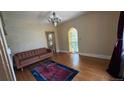 Bright living room featuring hardwood floors and a charming arched doorway at 2320 22Nd St, Boulder, CO 80304