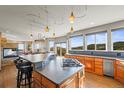 Spacious kitchen boasts an oversized island, stainless steel appliances, and scenic mountain views at 457 Buena Vista Rd, Golden, CO 80401