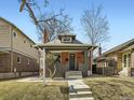 Charming home featuring a well-manicured lawn and inviting entryway, showcasing the exterior architecture at 2675 Irving St, Denver, CO 80211