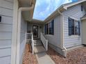 Charming home entrance with a welcoming front porch and well-manicured landscaping at 17145 Park Trail Dr, Monument, CO 80132