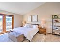 Spacious main bedroom with private access to balcony at 6220 Arapahoe Dr, Evergreen, CO 80439