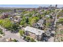 Stunning aerial view of the apartment building amidst a vibrant neighborhood, offering a glimpse of the city skyline in the distance at 200 N Sherman St # 2, Denver, CO 80203