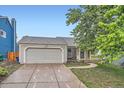 Charming single Gathering home with a two car garage, brick accents and inviting front porch at 10441 Routt Ln, Broomfield, CO 80021