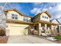 Two-story house with a front porch and landscaped yard at 8445 Braun Loop, Arvada, CO 80005