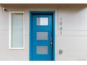 Stylish front door features a modern design with glass panes, a sleek handle, and clear property number for easy identification at 1941 Hooker St, Denver, CO 80204