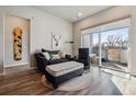 Cozy living room with modern furnishings and sliding door to private balcony at 9291 Twenty Mile Rd # 106, Parker, CO 80134