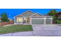 Charming home with a three-car garage and well-maintained lawn at 1838 Mountain Daisy Ct, Highlands Ranch, CO 80129