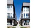 Contemporary townhouse complex showcasing symmetrical design and well-manicured walkway at 3043 W 19Th Ave, Denver, CO 80204