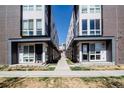 Modern townhouse exteriors featuring clean lines, brick accents, and a well-manicured walkway at 3043 W 19Th Ave, Denver, CO 80204