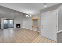 Bright and spacious living room featuring a fireplace, sliding glass doors, and an open layout at 11101 E Alameda Ave # 202, Aurora, CO 80012