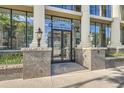 Elegant building entrance with grand columns at Colonnade Lofts at 1210 at 1210 E Colfax Ave # 206, Denver, CO 80218