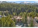 Beautiful complex nestled within a forest with views of snow-capped mountains in the distance at 805 Columbine Rd # 202, Breckenridge, CO 80424
