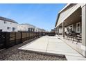 Spacious backyard featuring a covered patio, perfect for enjoying outdoor activities at 226 S Shady Grove Ct, Aurora, CO 80018