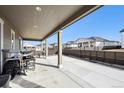 The outdoor covered patio, perfect for entertainment and relaxing in the backyard at 226 S Shady Grove Ct, Aurora, CO 80018