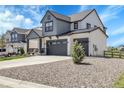 Charming home boasts a spacious driveway, complemented by manicured landscaping at 1174 Williams Loop, Elizabeth, CO 80107