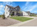 Beautiful two-story home with a spacious front yard and a well-maintained lawn at 1174 Williams Loop, Elizabeth, CO 80107