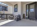 Inviting front porch with seating area, perfect for enjoying the outdoors at 1174 Williams Loop, Elizabeth, CO 80107