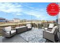 Outdoor living space with comfortable seating and string lights at 8395 E 132Nd Pl, Thornton, CO 80602