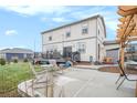 Spacious backyard with a patio, deck, pergola, and lush lawn offers ample space for outdoor entertaining at 8395 E 132Nd Pl, Thornton, CO 80602