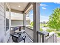 Inviting porch with a table, chairs, and views of the community at 3325 Umber Cir, Castle Rock, CO 80109