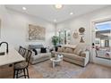 Spacious living room with open floor plan and lots of natural light at 3553 W 63Rd Ave, Denver, CO 80221