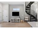 Modern metal spiral staircase leading to upper level at 3553 W 63Rd Ave, Denver, CO 80221