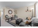 Living room with leather couches and patterned chairs at 8979 Field St # 21, Broomfield, CO 80021